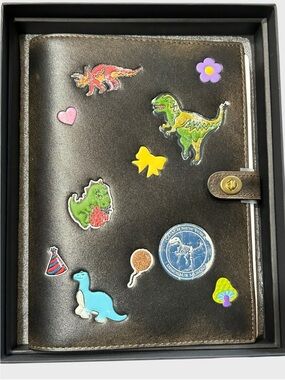 Coach Black Leather Notebook Cover with Colorful Dino Stickers